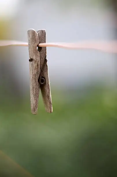 Photo of Wooden clothes peg on a washing line
