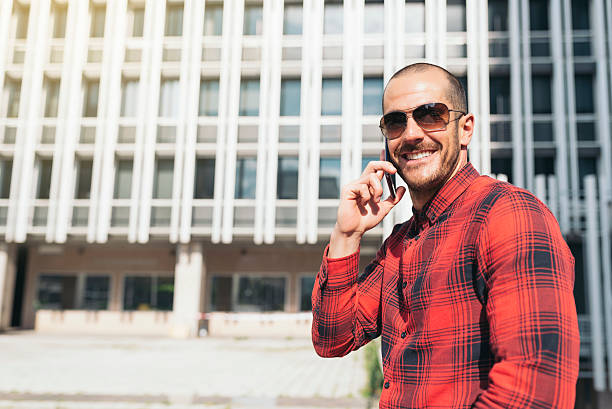 istock Young man with mobile phone in the city. 531995814