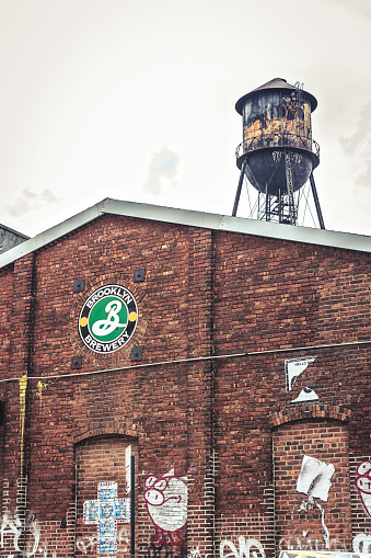 New York, USA - May 14, 2016: Exterior of one of the facilities of Brooklyn Brewery at Williamsburg - Brooklyn. The picture was taken on a saturday afternoon on springtime with a partially cloudy sky.