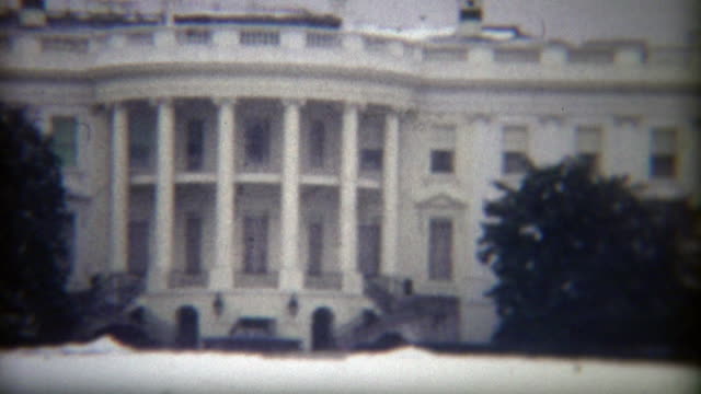 1972: Whitehouse snow covered lawn during winter.