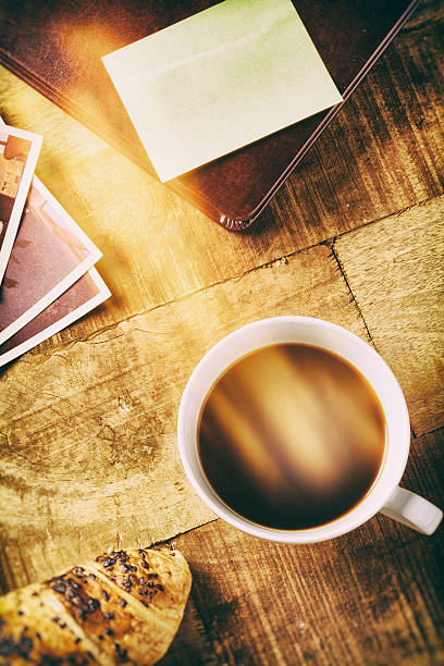istock Lens flare and coffe on table top 532004967