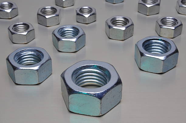 istock Group of steel nuts on metal surface 532006871