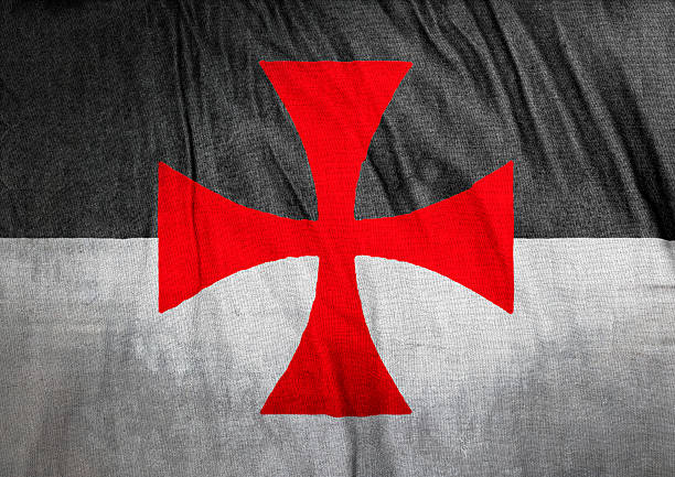 Flag of the Knights Templar Flag of the Knights Templar on wrinkled cloth texture. The Poor Fellow-Soldiers of Christ and of the Temple of Solomon, commonly known as the Knights Templar, the Order of the Temple or simply as Templars, were among the most wealthy and powerful of the Western Christian military orders. knights templar stock pictures, royalty-free photos & images