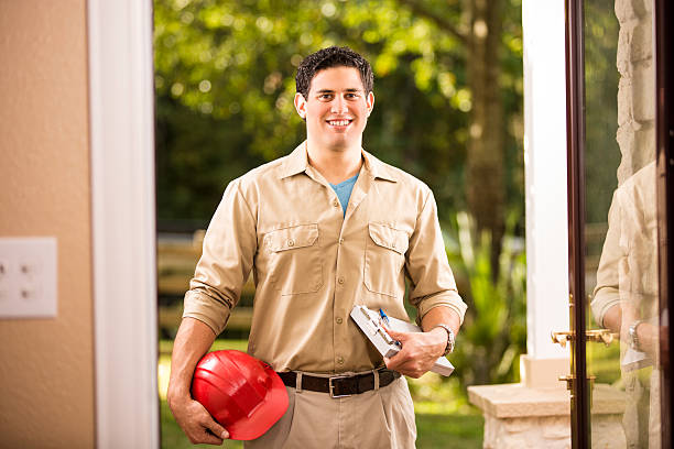 istock Service Industry: Latin descent repairman at customer's front door. 532008337