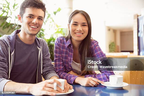 Young Students Smiling At Camera In Cafe Stock Photo - Download Image Now - 18-19 Years, 20-24 Years, 20-29 Years