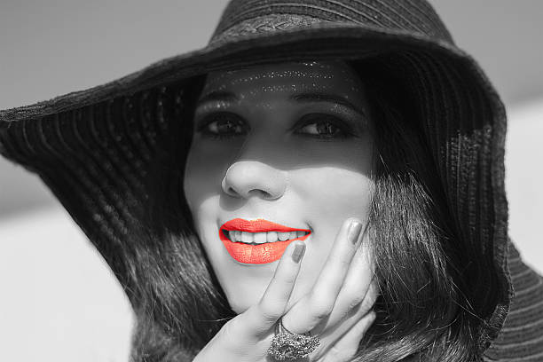 istock Smiling woman in black raffia hat. Red lips. 532010407
