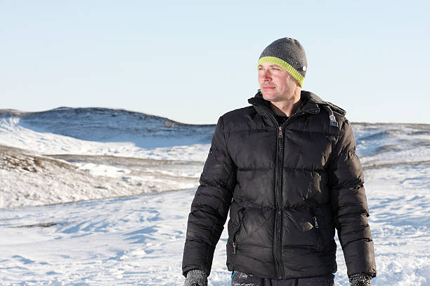 istock Middle-aged man standing in a landscape on the Sledge 532020363