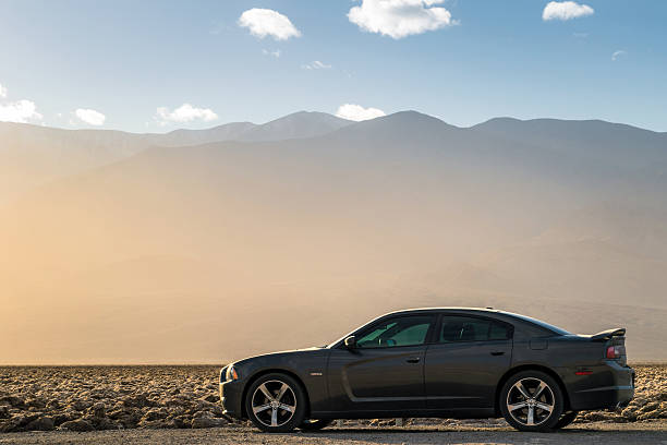 Dodge Charger Death Valley National Park, California - USA - December 25, 2014: A Dodge Charger on the desert. dodge charger stock pictures, royalty-free photos & images