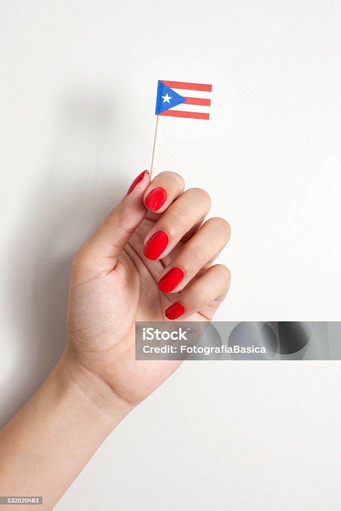 Holding puerto rican flag Woman hand holding tiny paper puerto rican flag 2015 Stock Photo