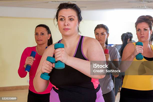 Womens Gym Fitness Class Using Weights Stock Photo - Download Image Now - Overweight, Exercising, People