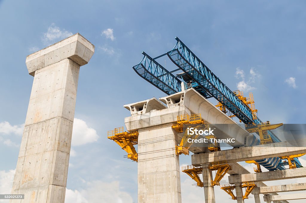 Construction in progress of a mass rapid transit line Construction of a mass transit train line in progress with heavy infrastructure.  This photo shows the progress in joining the various blocks/modules of the line with heavy equipment. Construction Industry Stock Photo