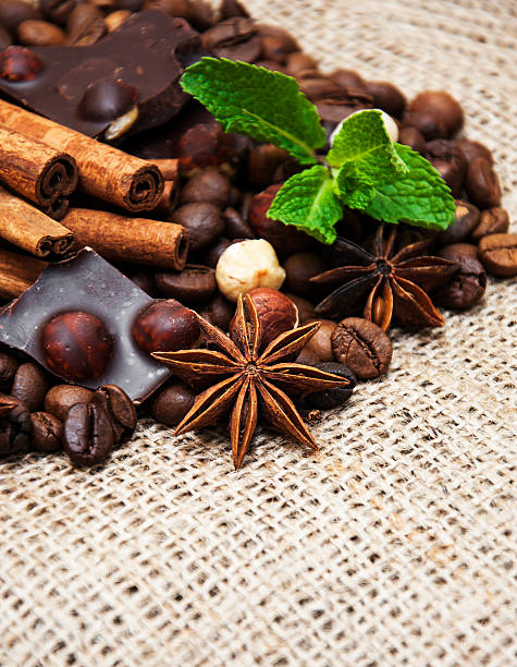 Coffee beans with cinnamon sticks and chocolate