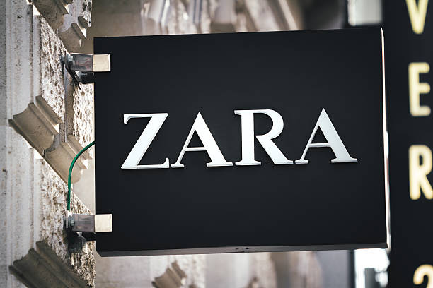 Zara Sign In Vienna Vienna, Austria - November 18, 2013: White Zara logo on a black background. Sign hanging above the entrance to the Zara shop in center of Wien. designer clothing photos stock pictures, royalty-free photos & images