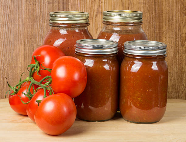 istock Tomato sauce in jars and tomatoes 532024135