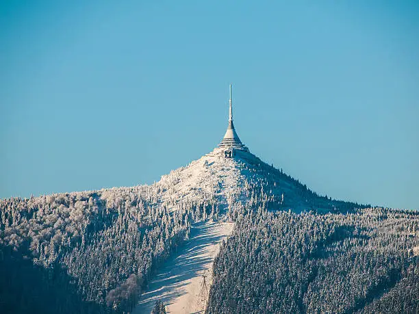 Hotel and transmitter Jested with ski slope in winter time, Czech Republic