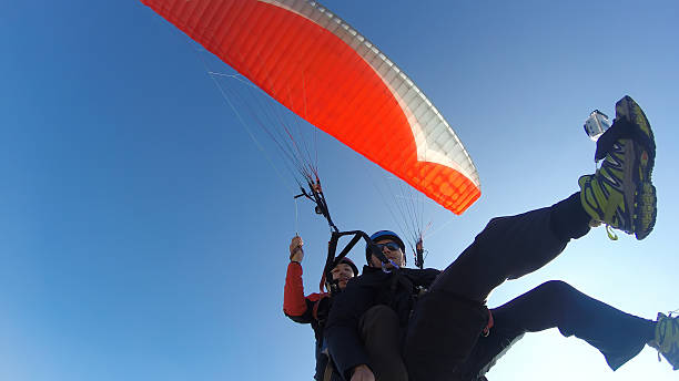 istock Tourist playing paragliding guided by a pilot 532025031