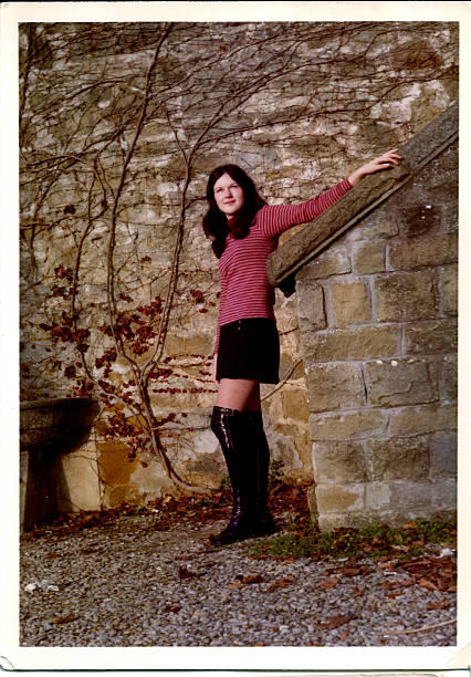 istock 70s young woman outside 532025491