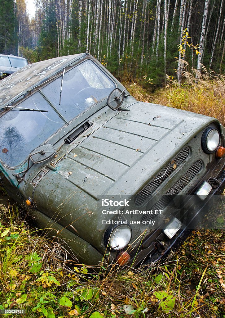 Russian Plain Road in the heart of Siberia Nizhny Tagil, Russia - September 22, 2012: Russian Plain Road in the heart of Siberia. Flailing at breakneck speed wheel off-road vehicle stuck in a swamp 2015 Stock Photo