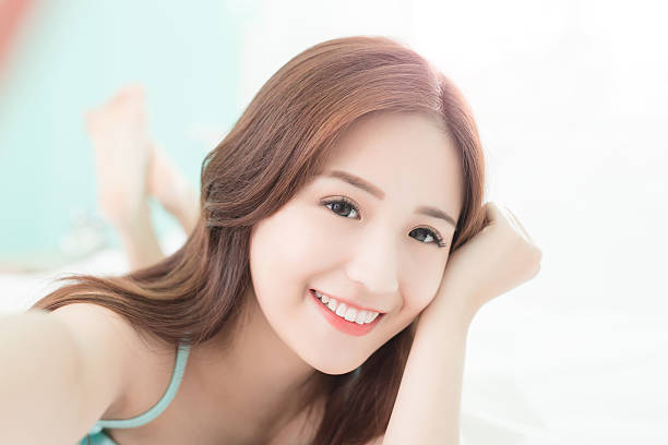 istock smile woman take a selfie 532031328