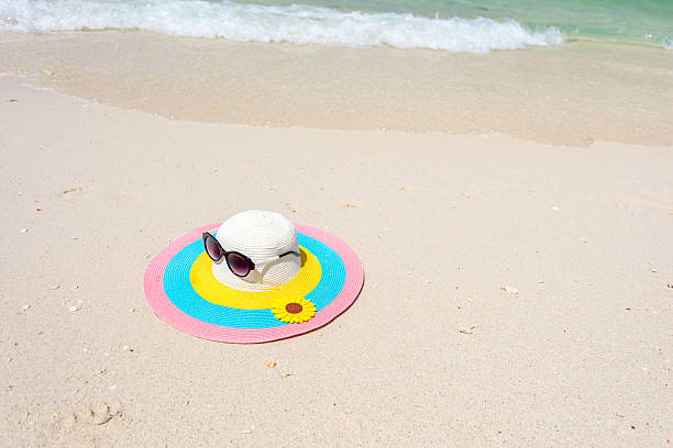 istock Colorful hat with glasses on the beach 532033724