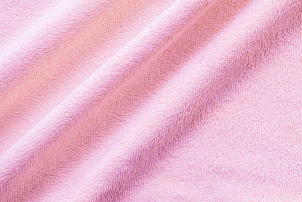istock Closeup wrinkled pink napkin fabric background 532038920