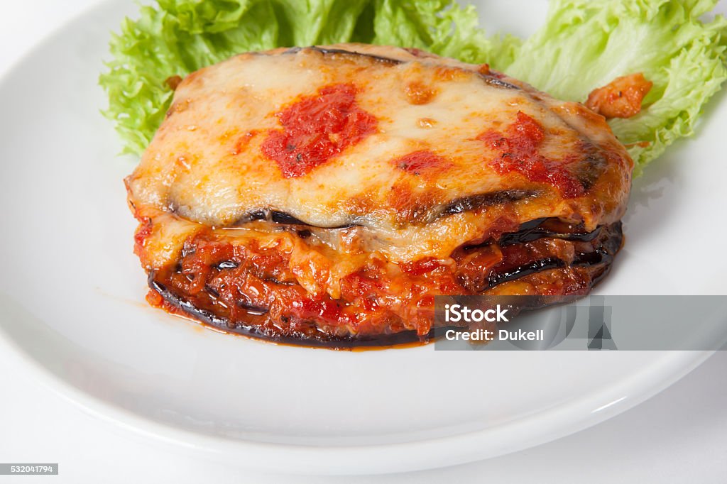 Baked eggplant, Parmigiana Baked eggplant, Parmigiana with cheese and lettuce Baked Stock Photo