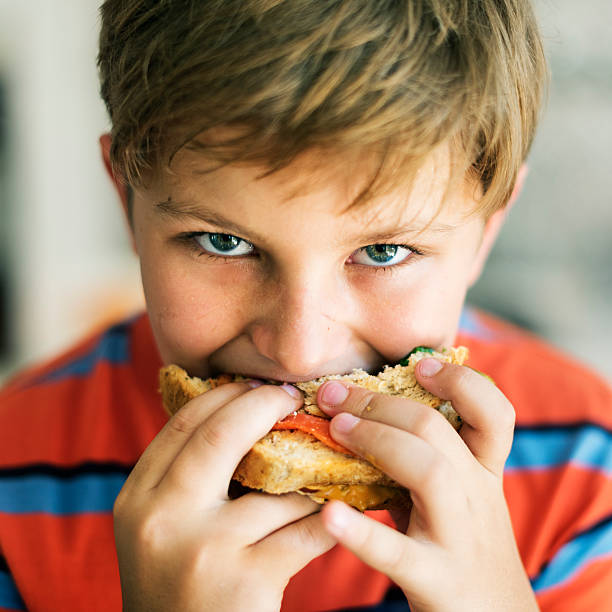istock Child Children Hungry Hunger Kid Sandwich Concept 532042604