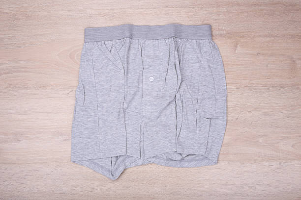 istock Men gray boxer shorts on wooden background 532046628