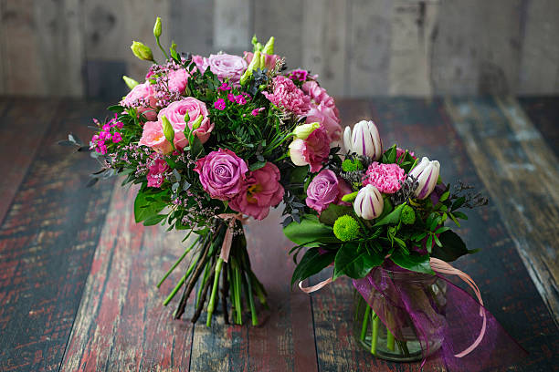 istock Rustic wedding bouquets with pink roses, carnations, daisies, and tulips. 532047028