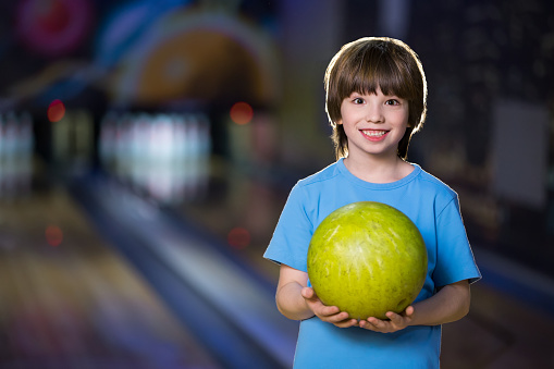 Smiling boy in bowling