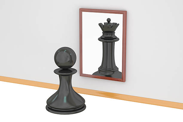 istock Pawn looking in the mirror seeing queen, strategy concept 532052932