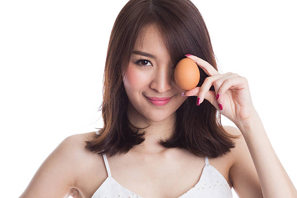 Woman with Egg stock photo