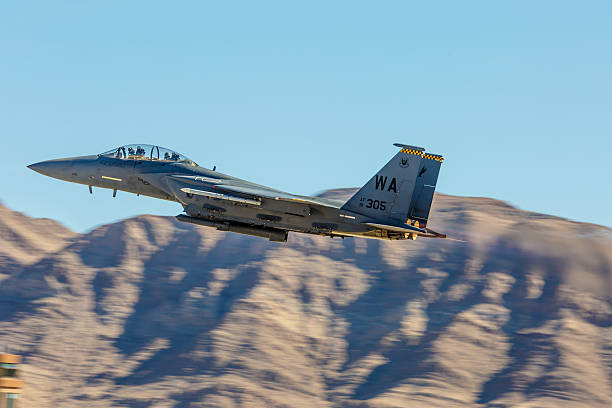 F-15 Eagle performs flyby during Aviation Nation at Nellis AFB Las Vegas, USA - November 8, 2014: F-15 Eagle performs flyby during Aviation Nation airshow at Nellis AFB on November 8,2014 in Las Vegas,NV. F-15 is a tactical fighter. It was designed by McDonnell Douglas.  supersonic airplane editorial airplane air vehicle stock pictures, royalty-free photos & images