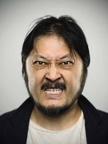 istock Portrait of a young japanese man with angry expression 532054708