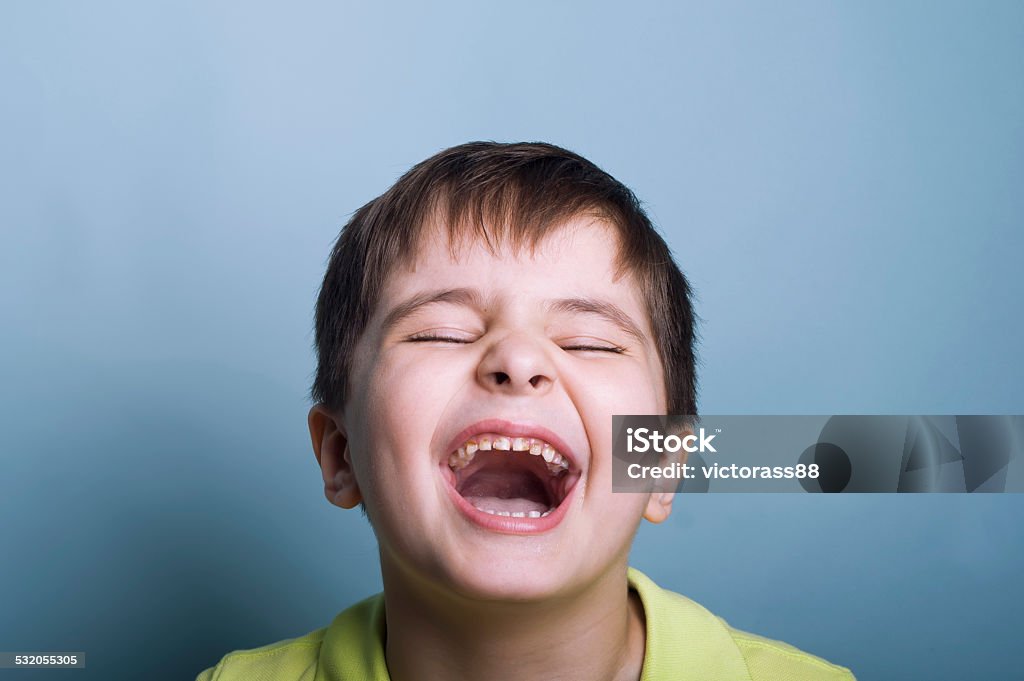 Crying Boy Ultimately emotional portrait of a boy crying or laughing with mouth open and marks of chocolate on his teeth. Studio horizontal shot Child Stock Photo