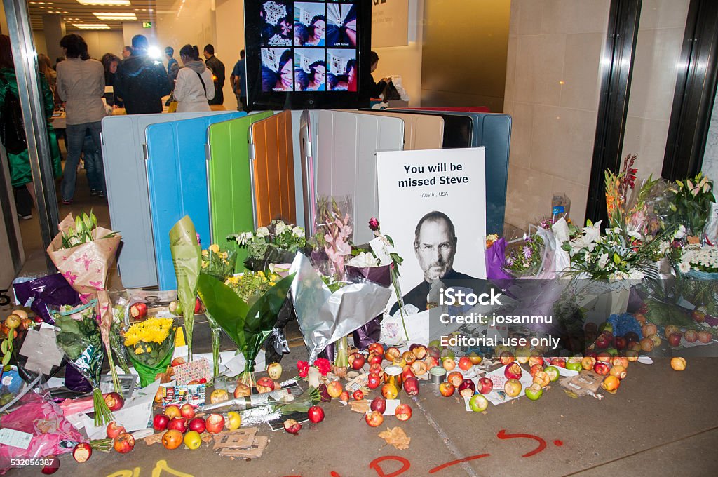condolences London, United Kingdom - October 10, 2011: condolences. Flowers and apples placed before the Aplle Store in Regent Street, as a tribute to Steve Jobs, who died five days earlier. Steve Jobs Stock Photo