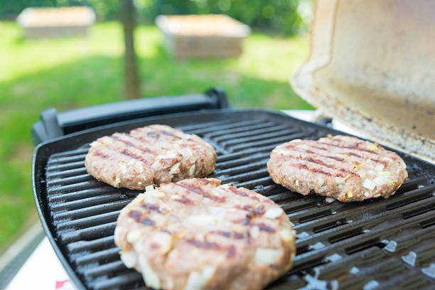 istock Grilling Burgers at picnic 532056706
