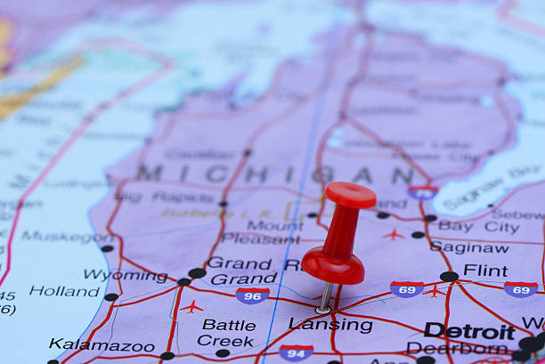 Lansing pinned on a map of USA Photo of pinned Lansing on a map of USA. May be used as illustration for traveling theme. michigan stock pictures, royalty-free photos & images