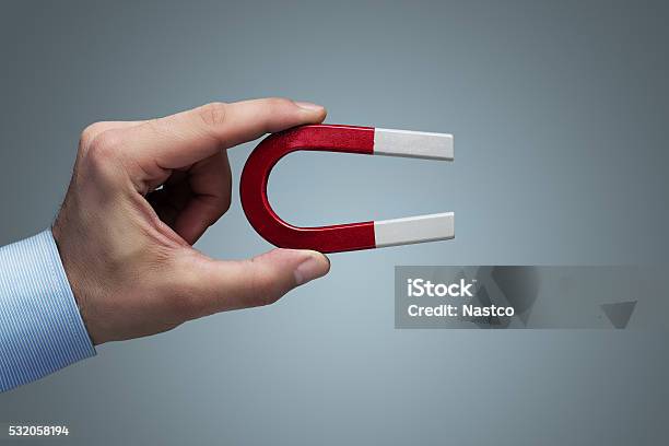 Hand Holding Magnet Stock Photo - Download Image Now - Magnet, Holding, Magnetic Field