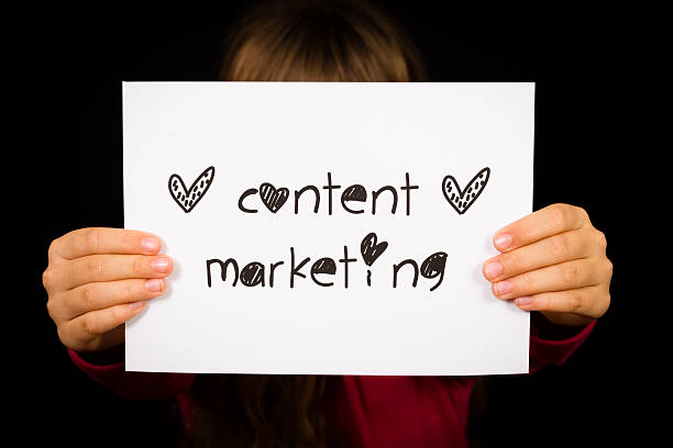 istock Child holding Content Marketing sign 532058893