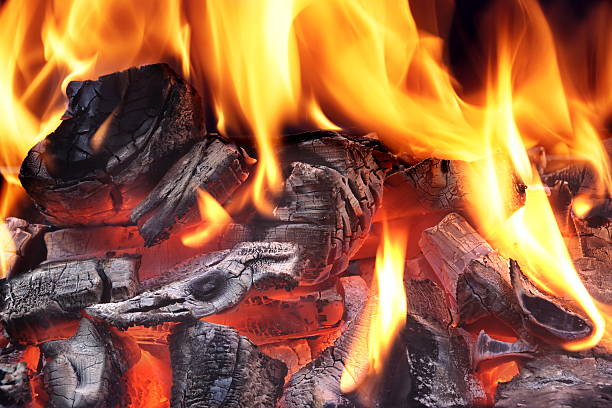 istock Flaming Charcoal Isolated On Black Background 532059184