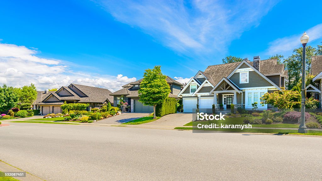 Perfect Neighbourhood A perfect neighbourhood. Houses in suburb at Spring in the north America. Residential District Stock Photo