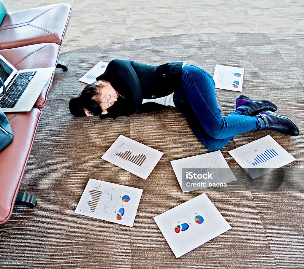 overloaded with work Female businesswoman overloaded with work at airport waiting room. 2015 Stock Photo