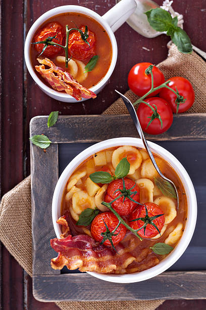 zuppa di pomodoro con pasta - stuffing celery onion spoon foto e immagini stock