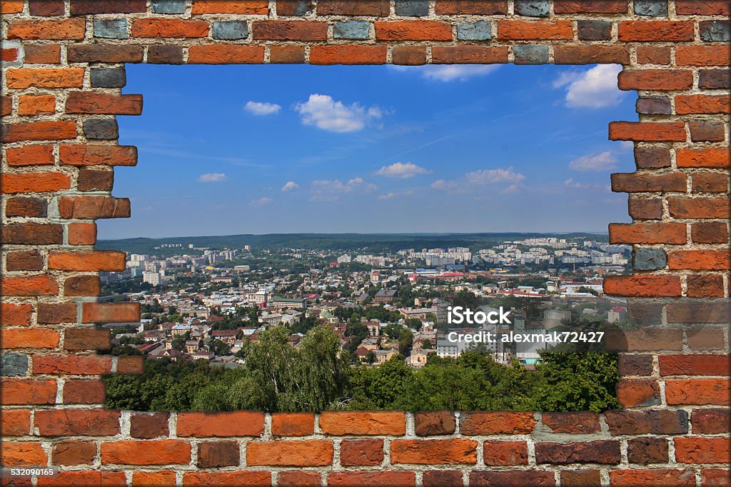 broken wall from red brick and view to the city broken wall from the red brick and view to the big city 2015 Stock Photo