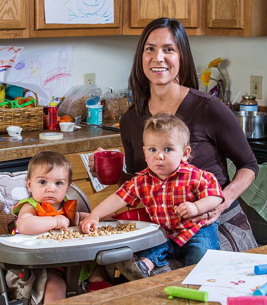 istock Mother Smiles With Babies 532091363