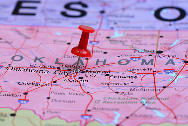 Oklahoma City pinned on a map of USA Photo of pinned Oklahoma City on a map of USA. May be used as illustration for traveling theme. oklahoma city stock pictures, royalty-free photos & images