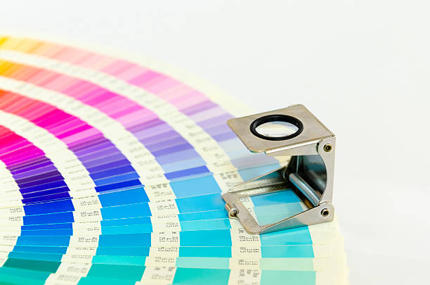 istock Magnifying glass standing on color guide on a white background 532092105