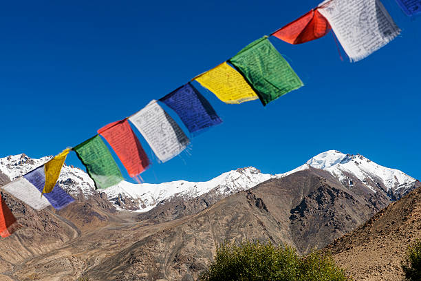 istock snow mountain range and tibetan prayer flags in the village 532094801
