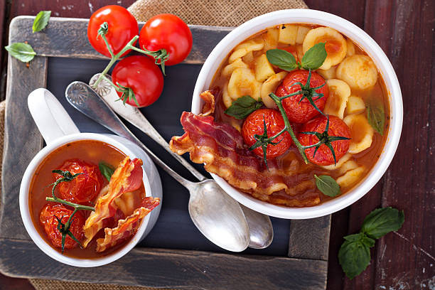 zuppa di pomodoro con pasta - stuffing celery onion spoon foto e immagini stock